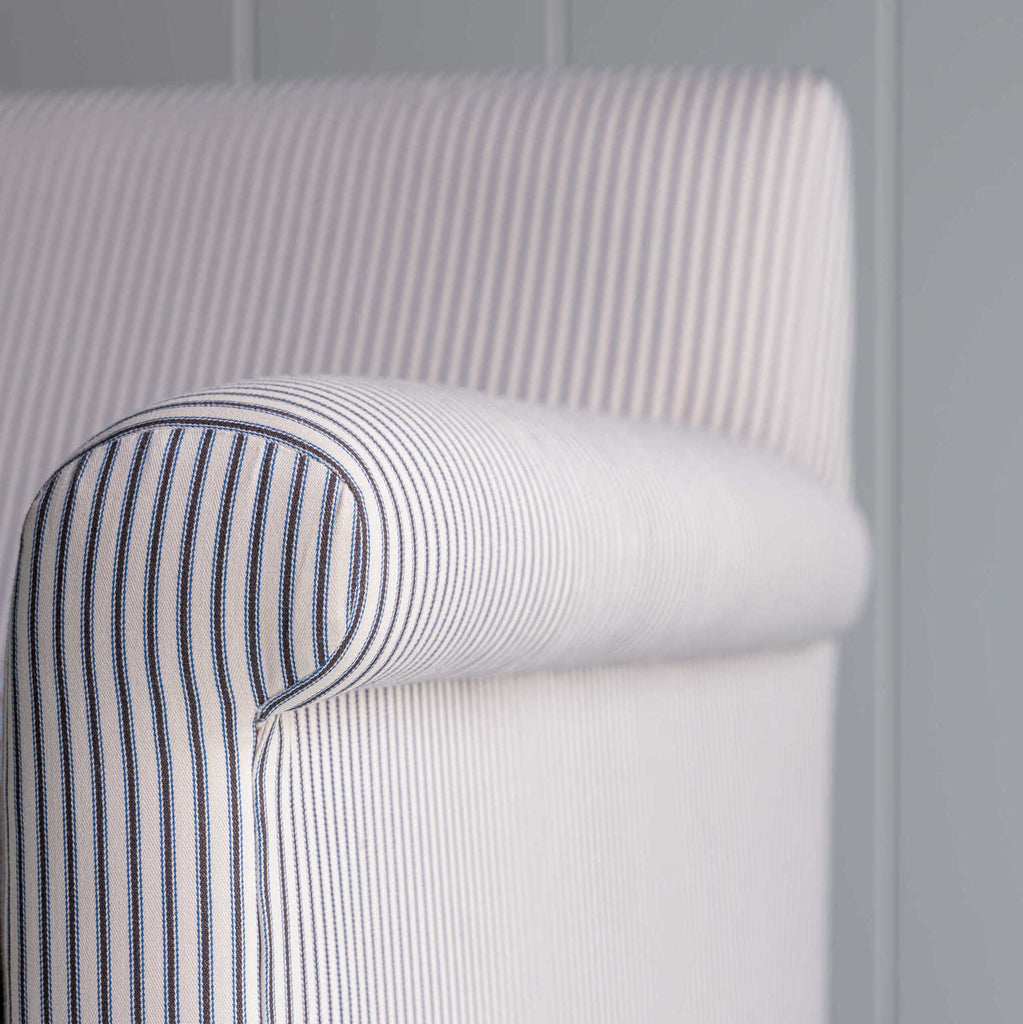  Close-up of the arm design of the Idler 2-seater sofa in Ticking Cotton Chocolate Navy fabric by NiX. 