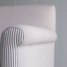  Close-up of the arm design of the Idler 2-seater sofa in Ticking Cotton Chocolate Navy fabric by NiX. 