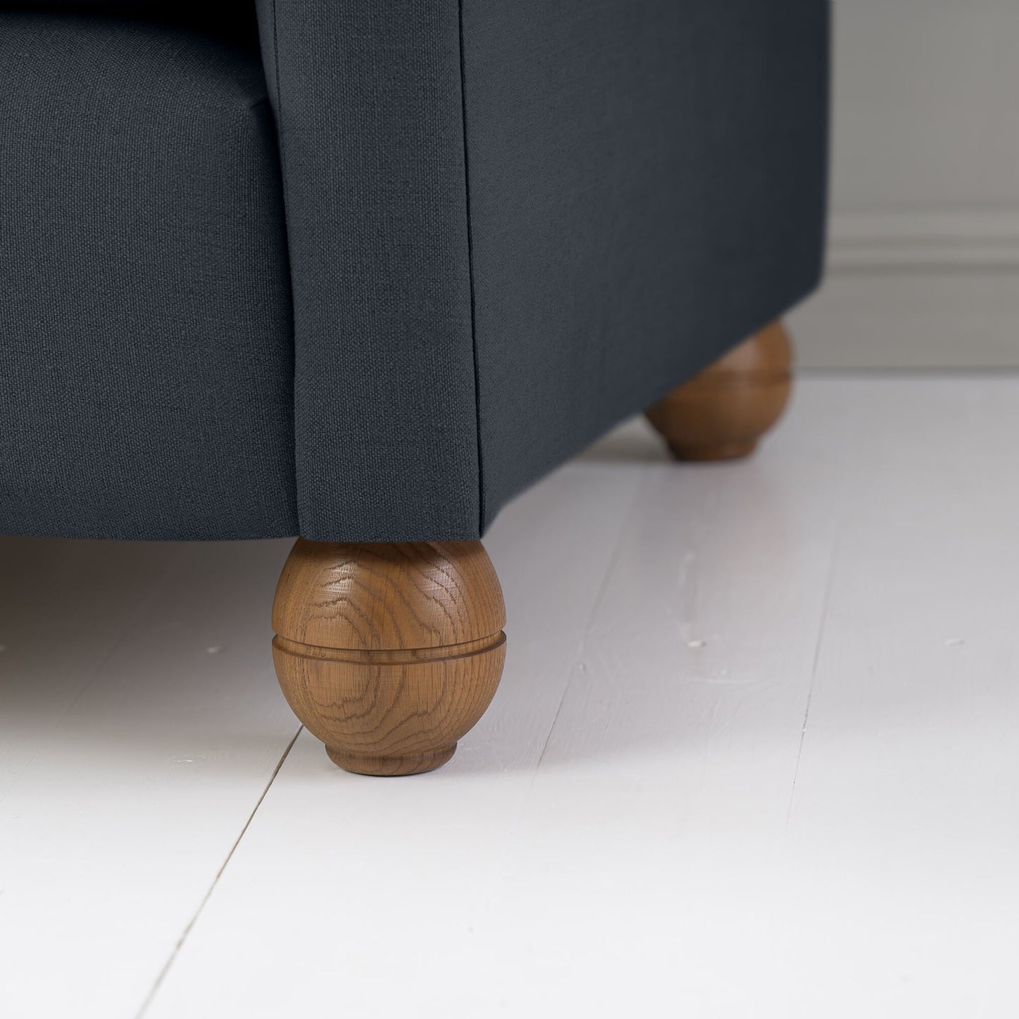 Closeup of Round Wooden Foot Design - By Nicola Harding & Co.