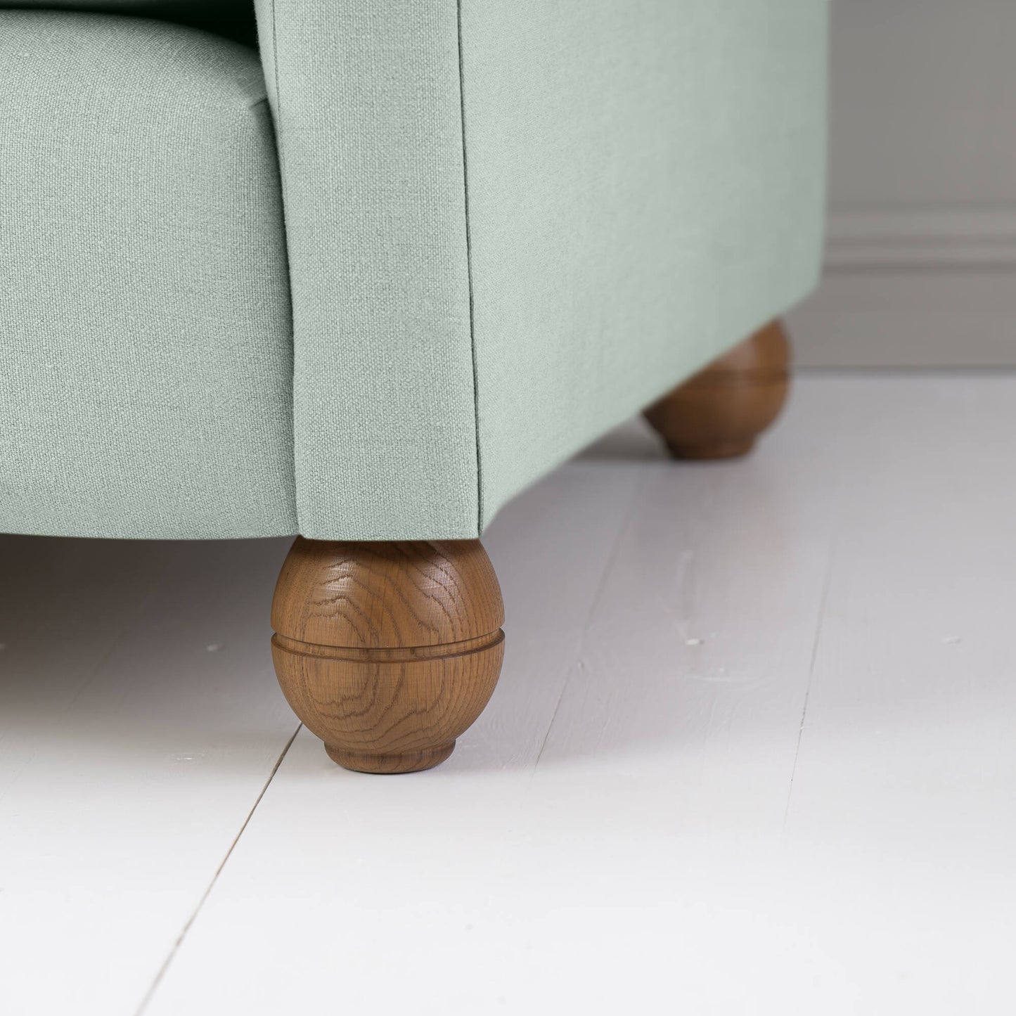 Round Wooden Foot Closeup of Idler 4 seater sofa in Laidback Linen Sky - Nicola Harding & Co.
