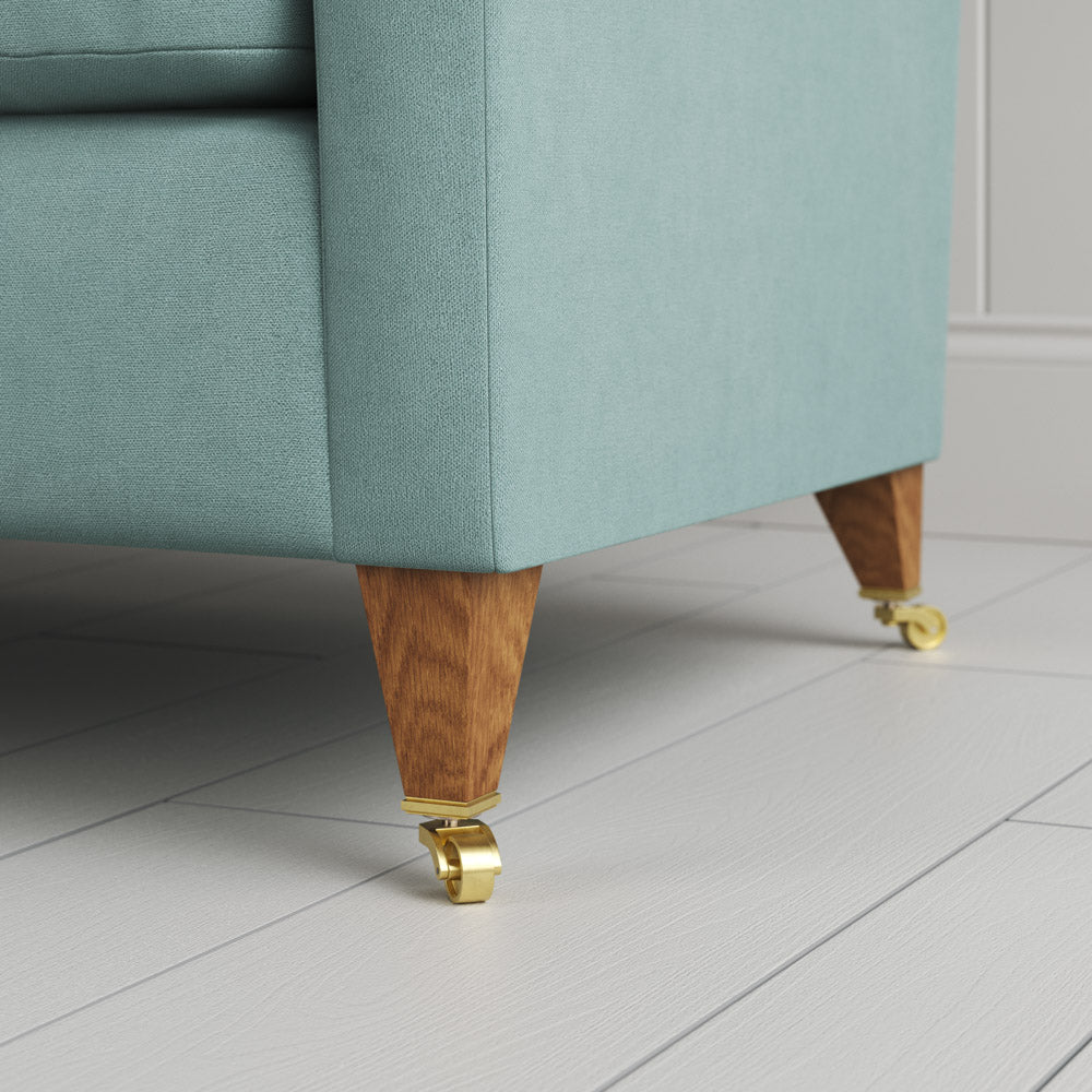  Tapered feet and castors on the Cerulean linen Idler by Nix. 