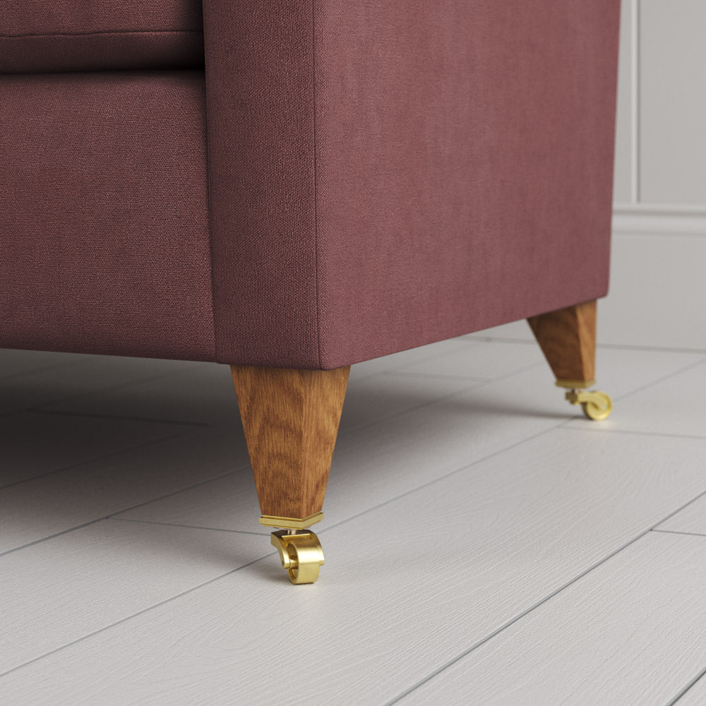  Tapered feet and castors on the Damson linen Idler by Nix. 