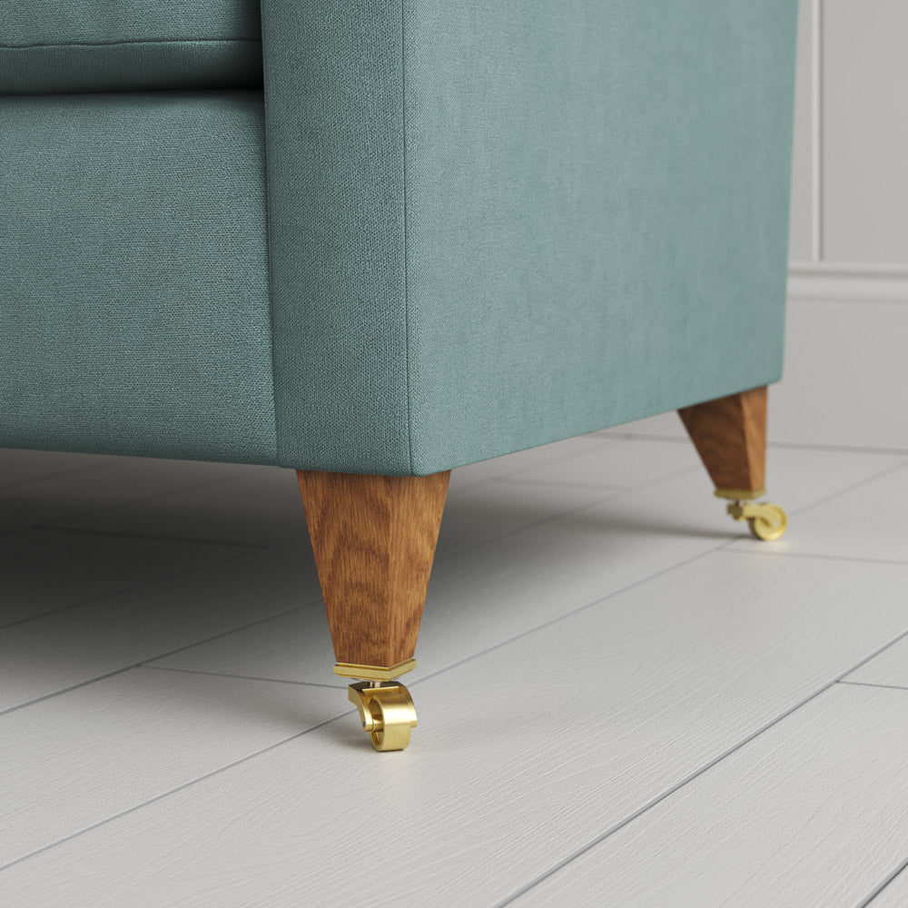  Closeup of feet and castors on the Mineral linen Idler seat by Nix. 