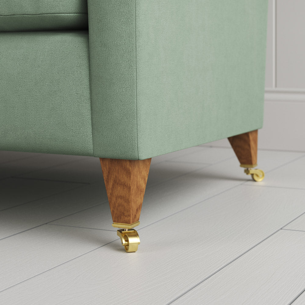  Details of feet and castors on the Moss linen Idler seat by Nix. 