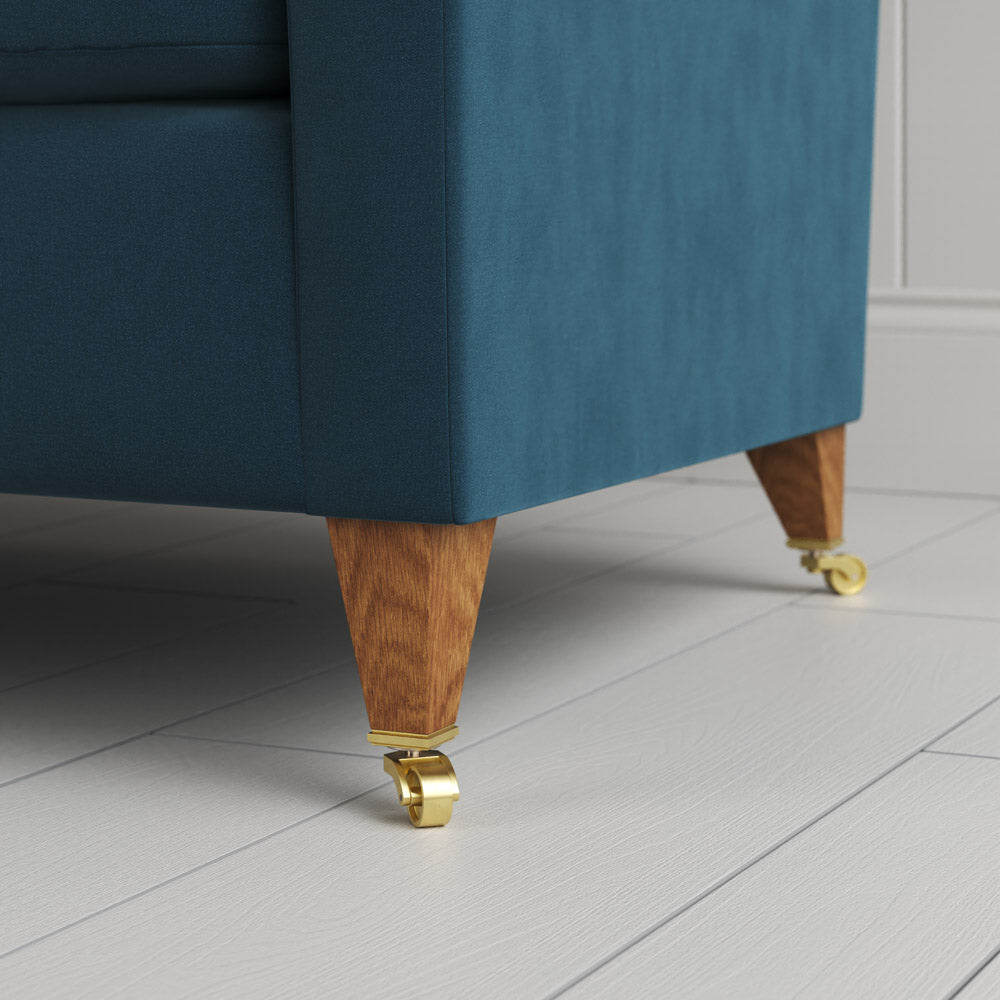 Idler sofa tapered leg and caster wheel in Velvet Aegean by NiX