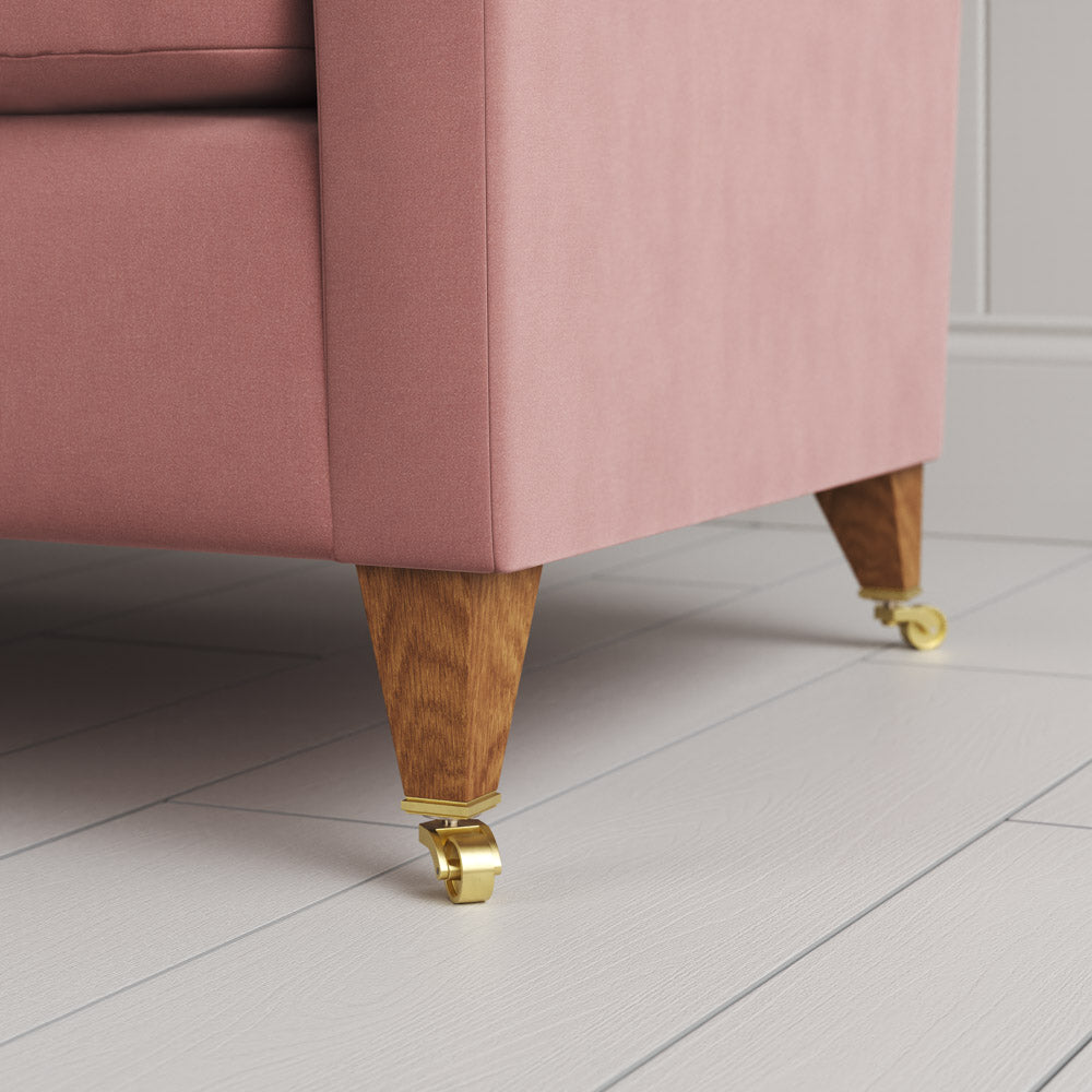  Tapered feet and castors on the Rose velvet Idler seat by Nix. 