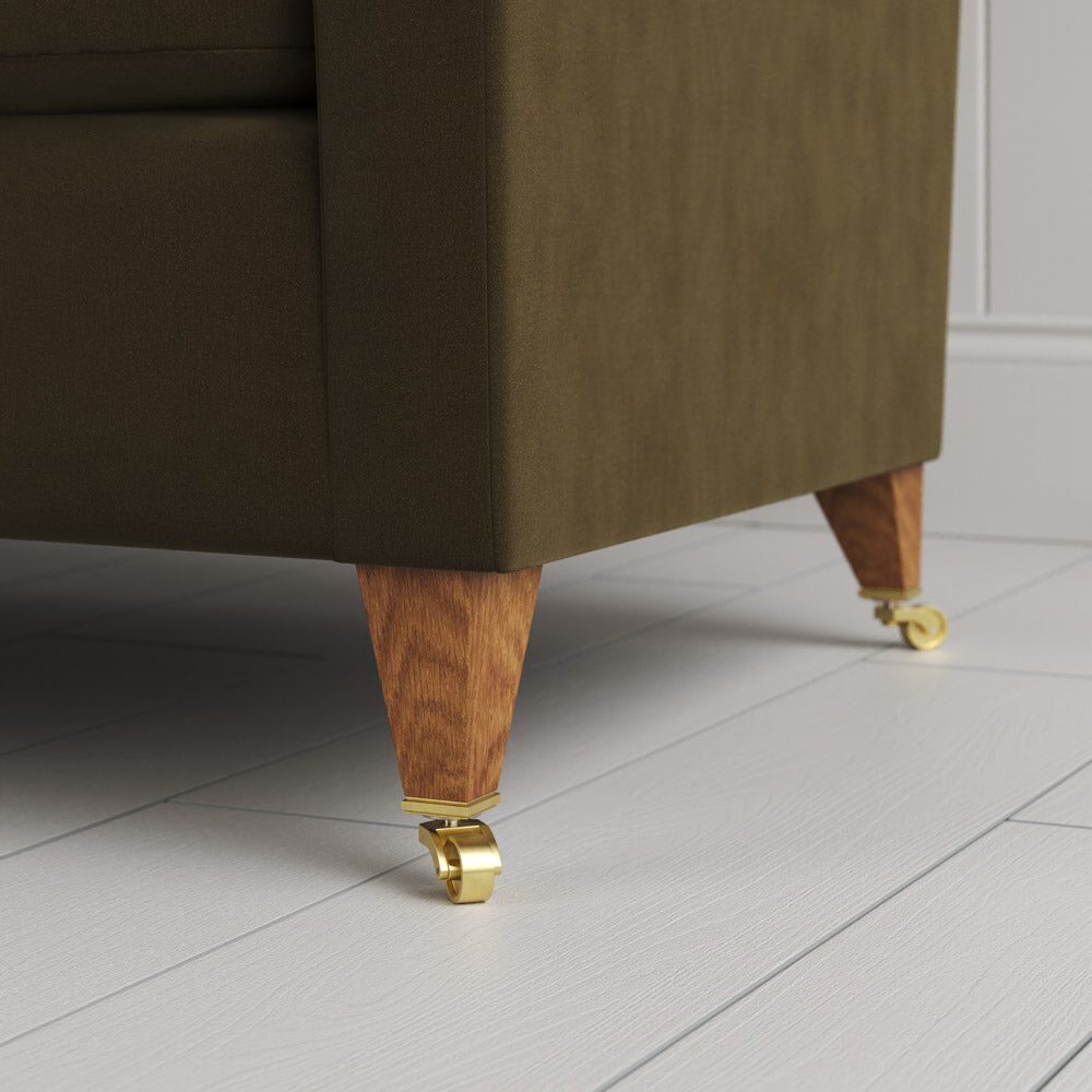  Tapered feet and castors on the Seaweed velvet Idler seat by Nix. 