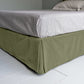 Cloud Nine Upholstered Bed in Intelligent Velvet Green Tea with Kick Pleat Valance, showcasing the edge design and a neatly tucked-in bedsheet.
