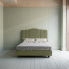  King Size Cloud Nine Upholstered Bed in Intelligent Velvet Green Tea front view with mattress and pillows. 