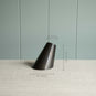  A black part of lamp, a simple yet measuring image. 