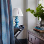  Sunburst Concertina Natural Pleat Lamp Shade with Mauve Cord, With Hourglass Ceramic Table Lamp Base in Blue, On a Ready Steady Tray Table, Coal Black - By NiX 