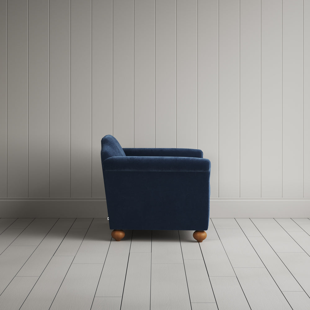  Side profile of the dark blue corduroy Dolittle love seat 