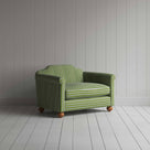  Green and white striped sofa on wooden floor. 