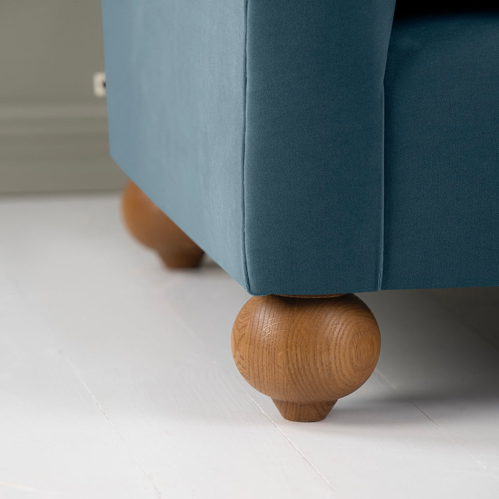  Dolittle Love Seat in Intelligent Velvet Aegean, With Round Wooden Foot Closeup - Nicola Harding 