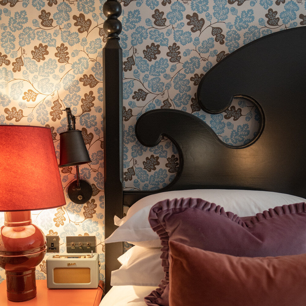  Acorn wallpaper in Sugarbag Blue and Mushroom, implemented in a bedroom, designed by Nicola Harding & Co. 