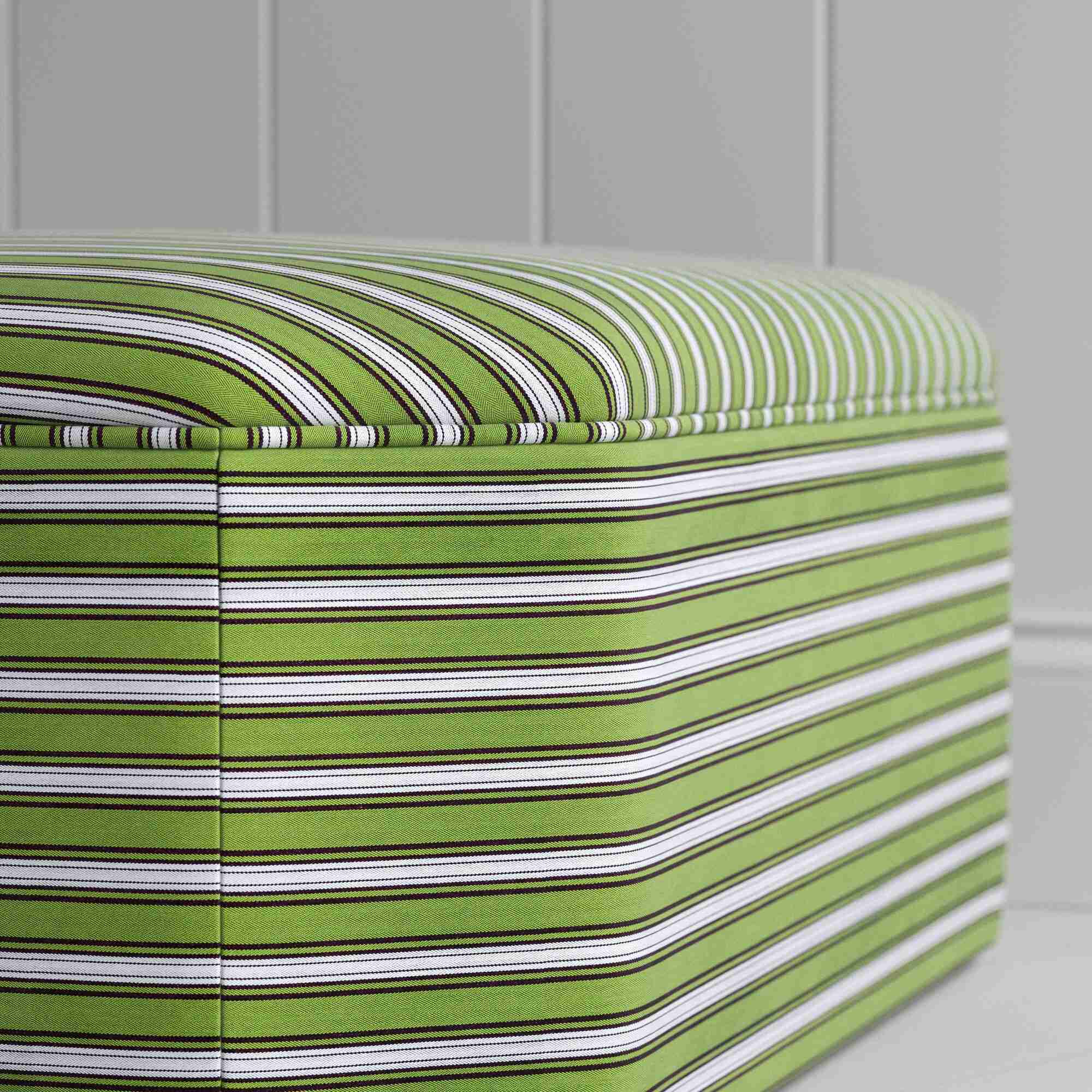  Zoomed stylish green and white striped ottoman, ideal for enhancing the aesthetic of your living space. 