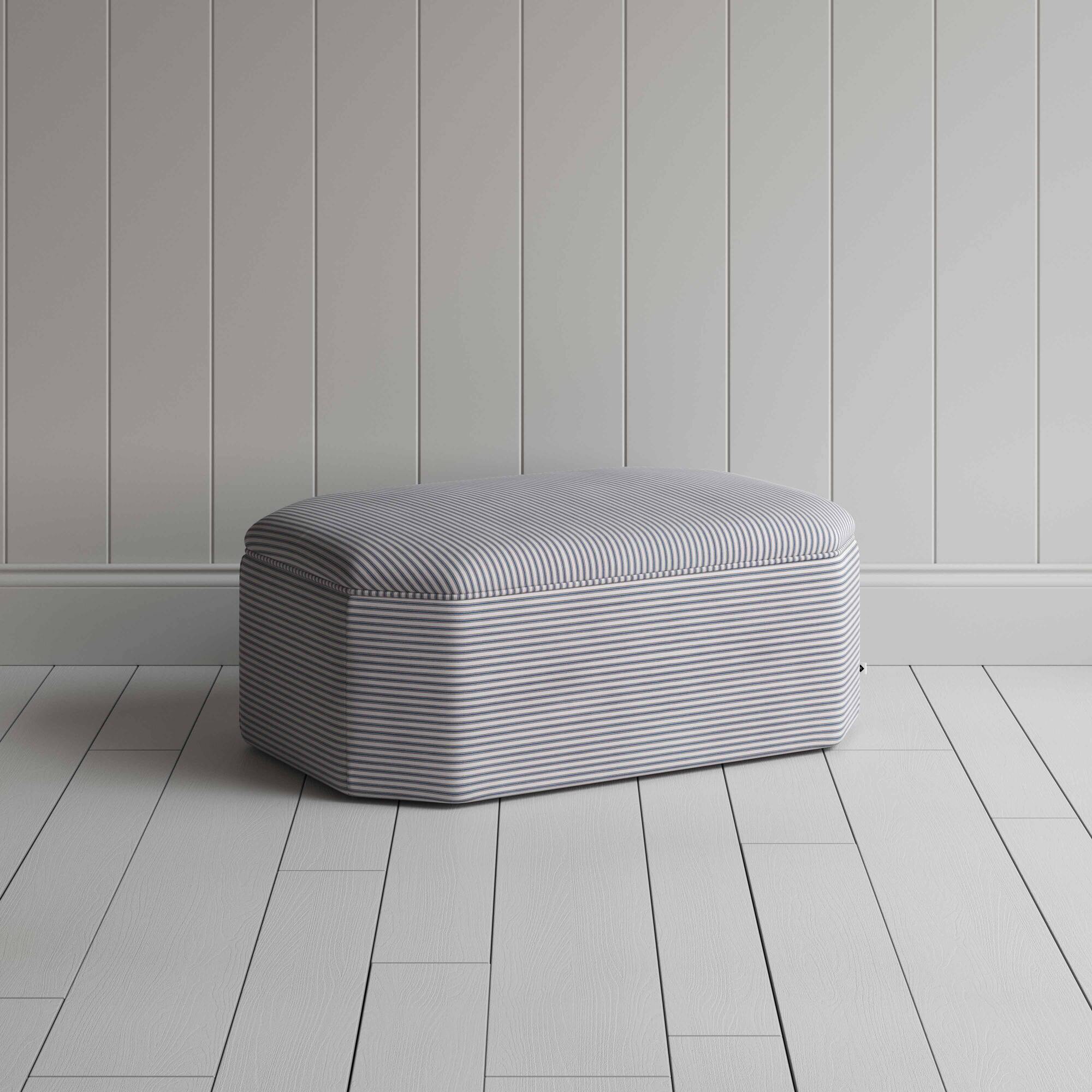  Grey and white striped ottoman on white floor 