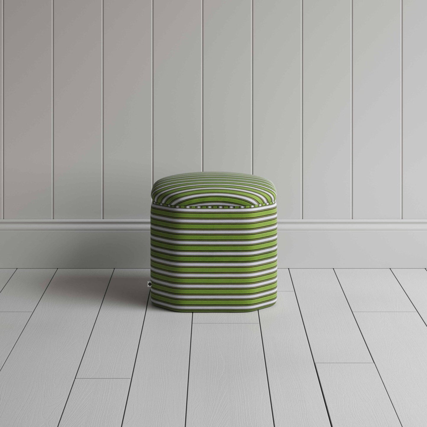 A white and green stripped ottoman.