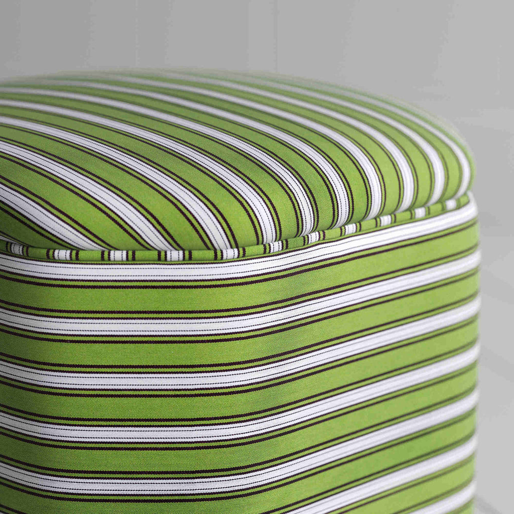  Green and white striped ottoman, perfect for adding a pop of color to any room decor. 