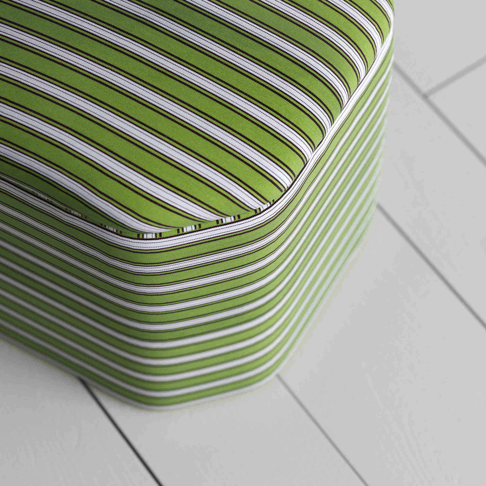  A green and white striped box, perfect for using as decorative piece. 