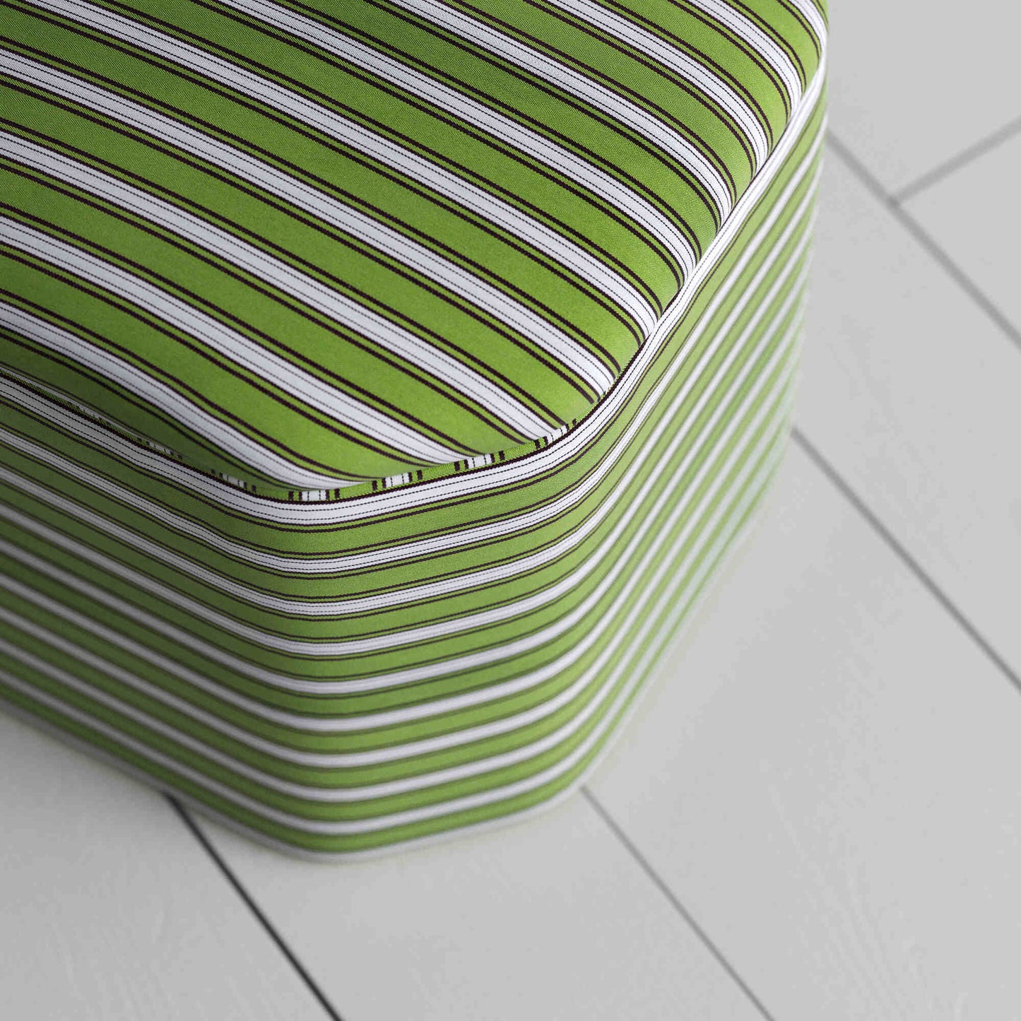 A green and white striped box, perfect for using as decorative piece.