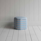  Small ottoman with blue and white stripes, ideal for a stylish and cozy seating option. 