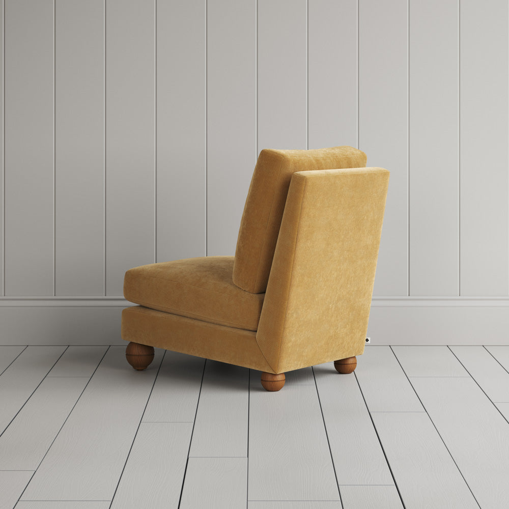  Back profile of the Perch armchair in Wheat corduroy, showing the sturdy British craftsmanship. 