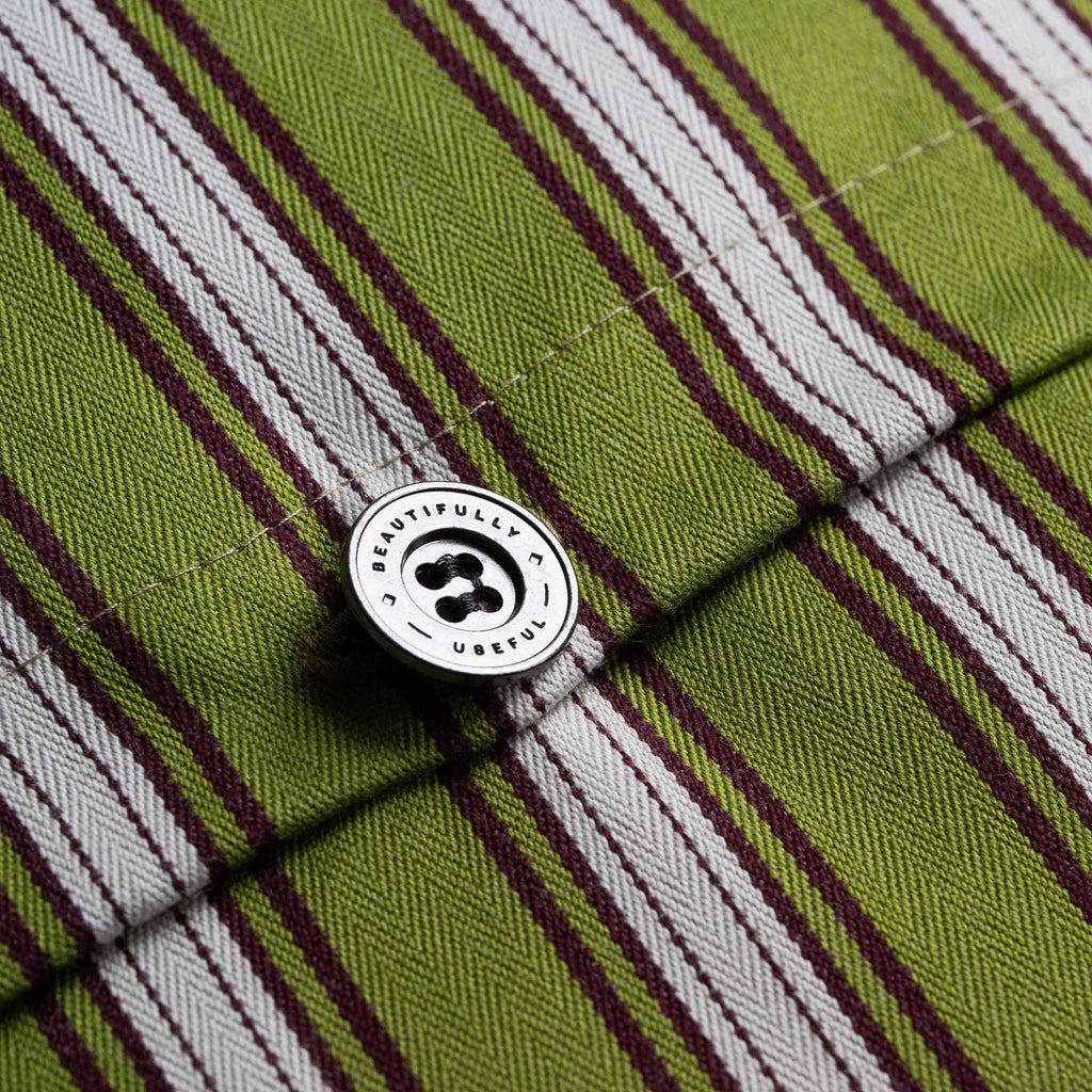  A close-up of a green and white striped shirt with button, showcasing its vibrant colors and stylish pattern. 