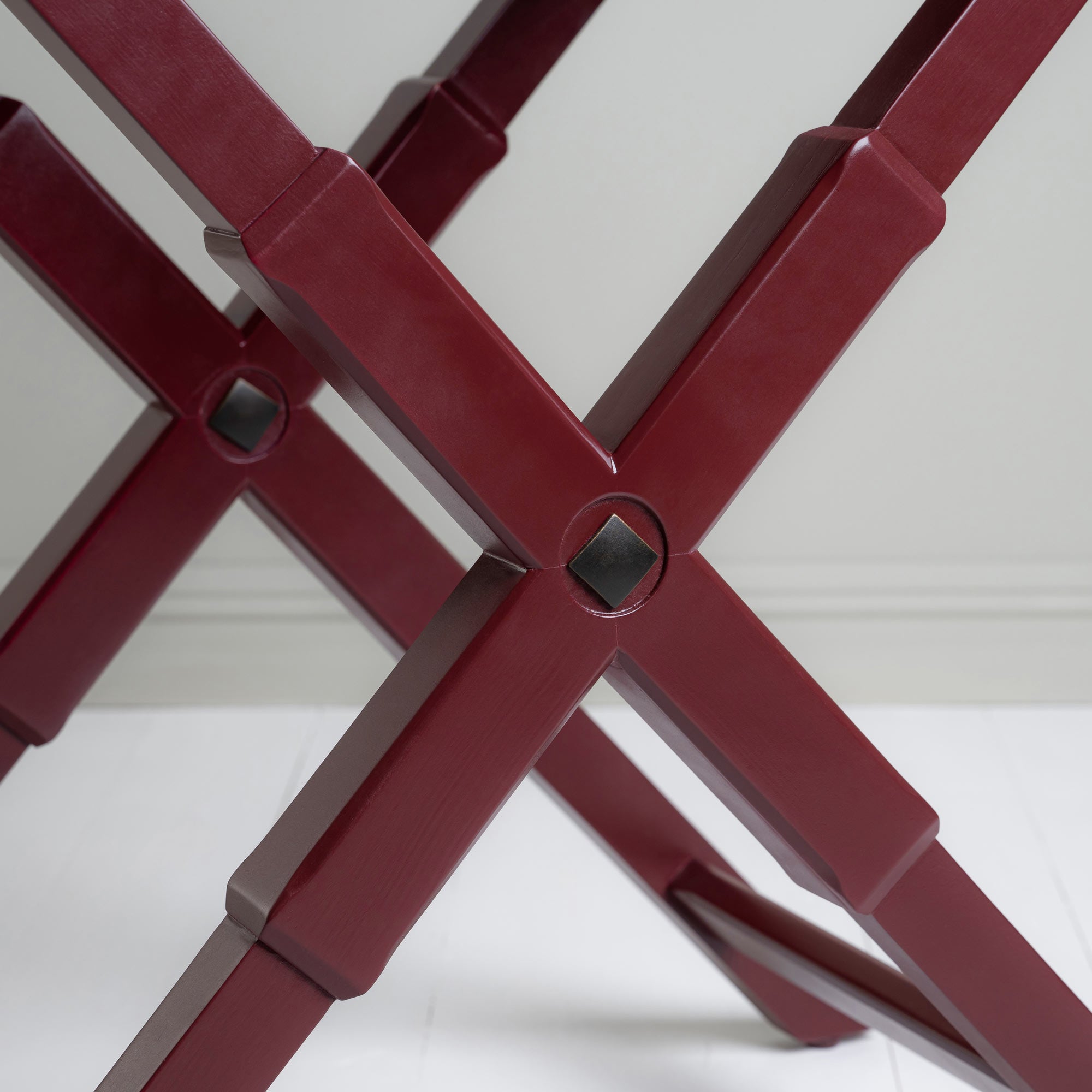  Leg design of the Ready Steady Tray Table in Berry Red, featuring a stylish and modern look. 