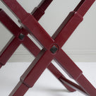  Leg design of the Ready Steady Tray Table in Berry Red, featuring a stylish and modern look. 