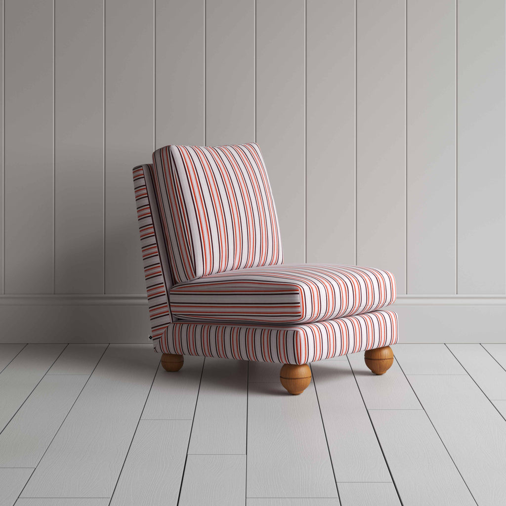  Striped armchair with wooden legs on white floor. 