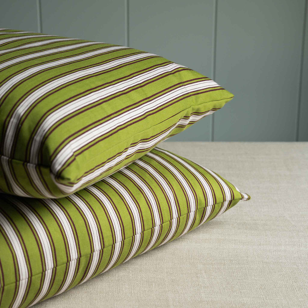  Two decorative cushions with striped green and white pattern. 