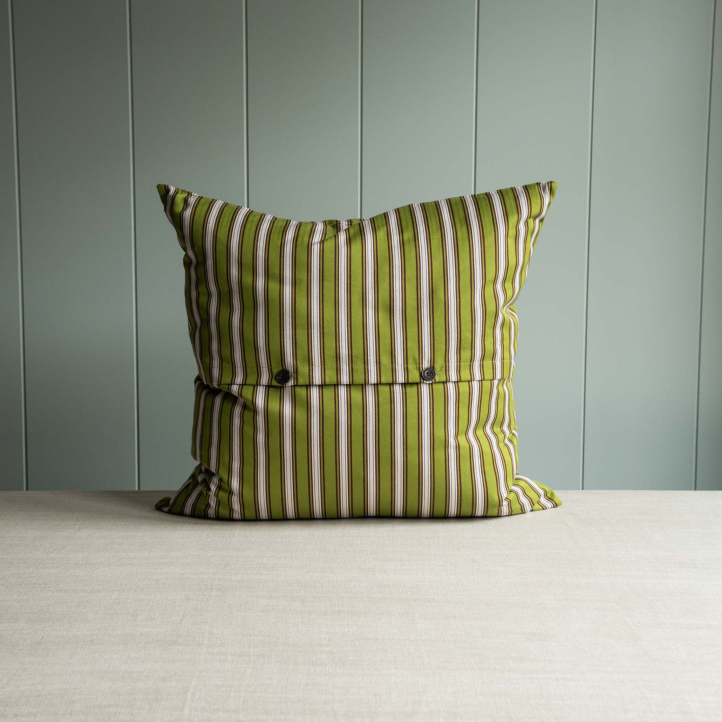 Striped pillow in green and white alternatives with two buttons