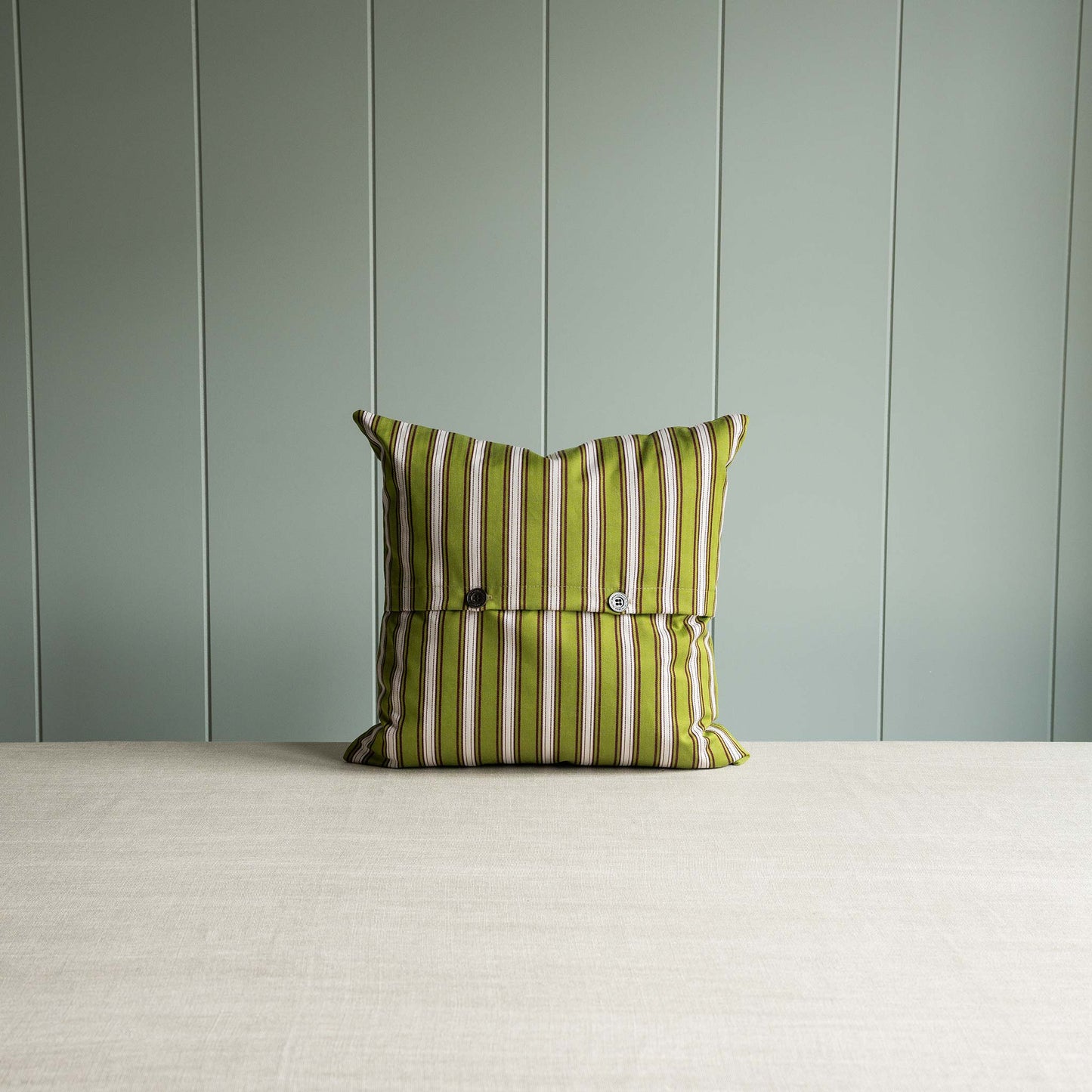 Showing green and white striped pillow.