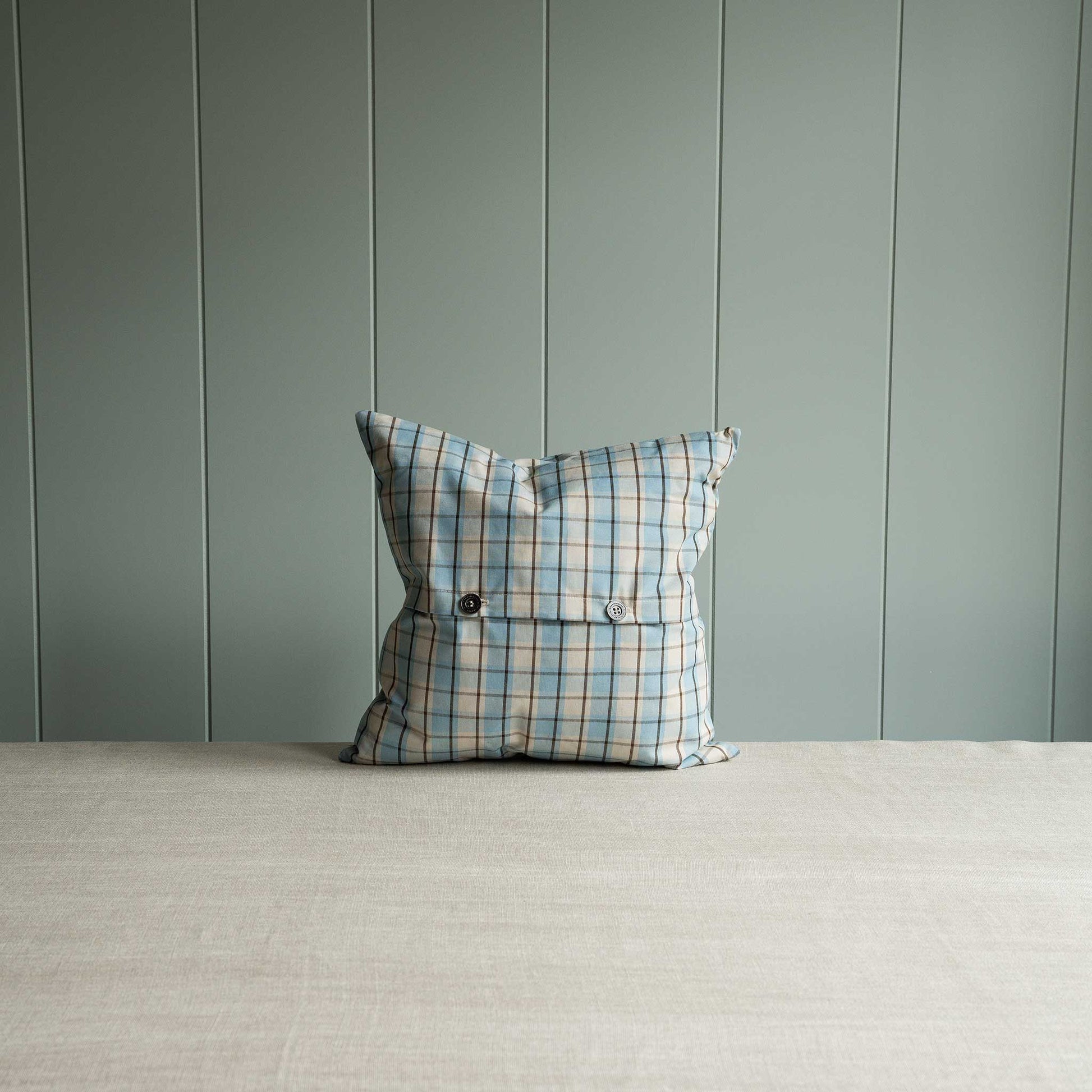 Blue and white plaid patterned pillow 