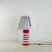 image of Humbug Striped Ceramic Table Lamp Base in Cherry Red & Warm White
