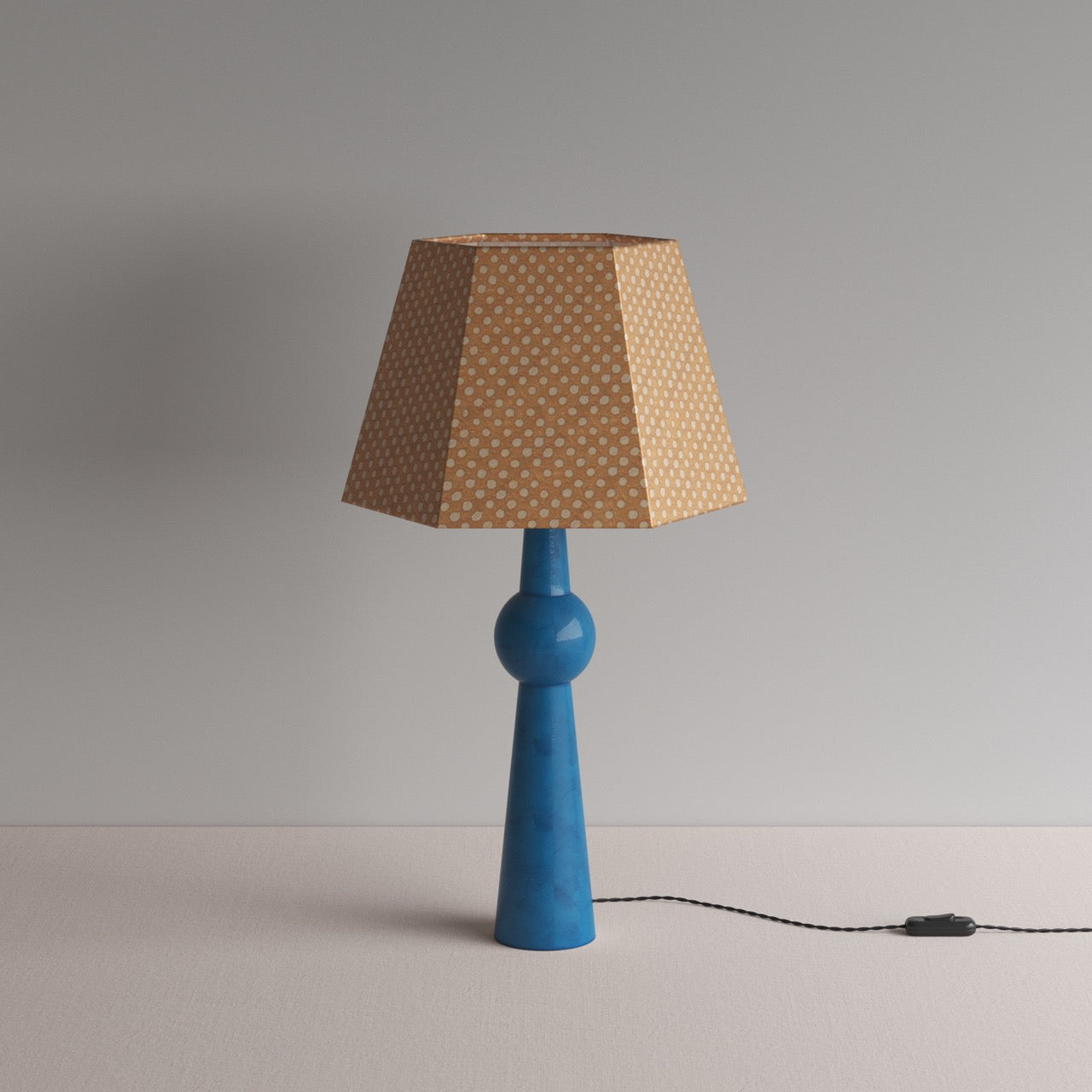 Comet Ceramic Table Lamp Base in Blue, With Townhouse Hexagonal Lamp Shade in Dotty Tan - Nicola Harding