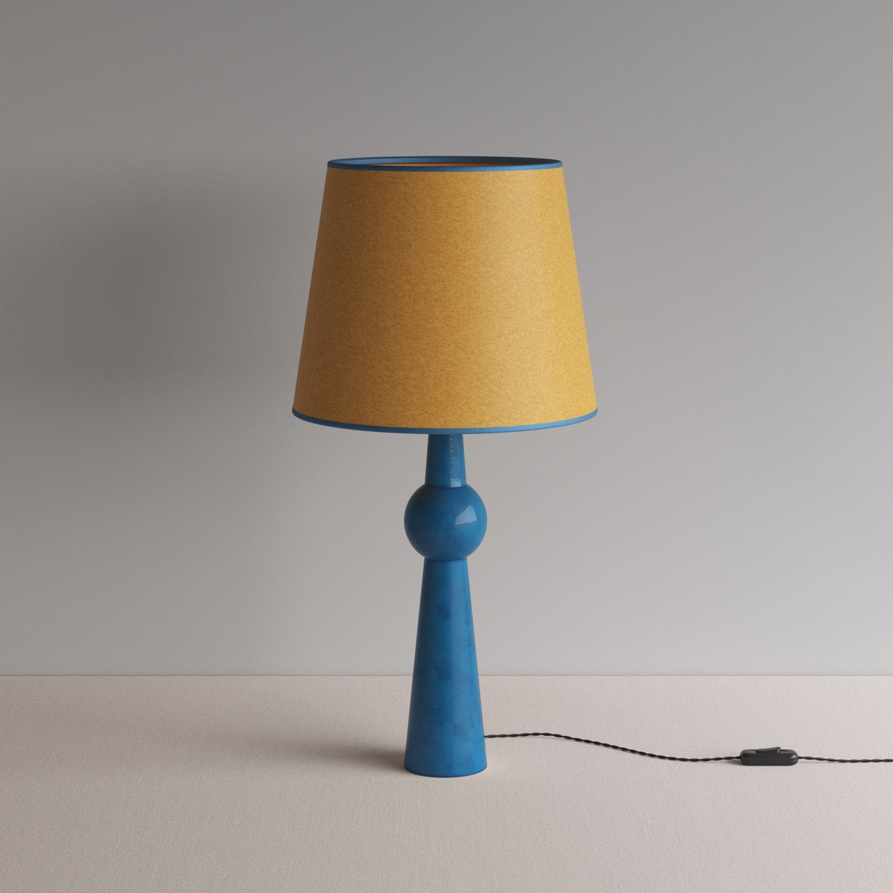 Comet Ceramic Table Lamp Base in Blue, With Humbug Straight Empire Paper Lamp Shade in Mustard with Blue Trim - Nicola Harding