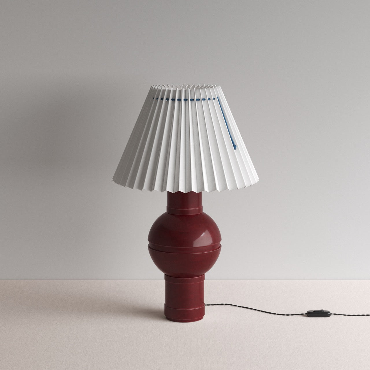 Orb Ceramic Table Lamp Base in Red, With Sunburst Concertina Natural Pleat Lamp Shade with Blue Cord - Nicola Harding