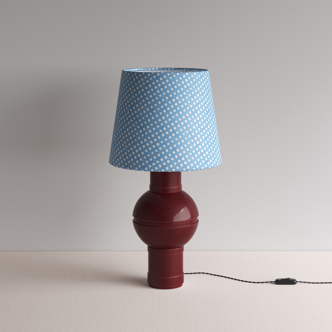  Orb Ceramic Table Lamp Base in Red, With Humbug Straight Empire Batik Paper Lamp Shade in Dotty Sky Blue
 - Nicola Harding 