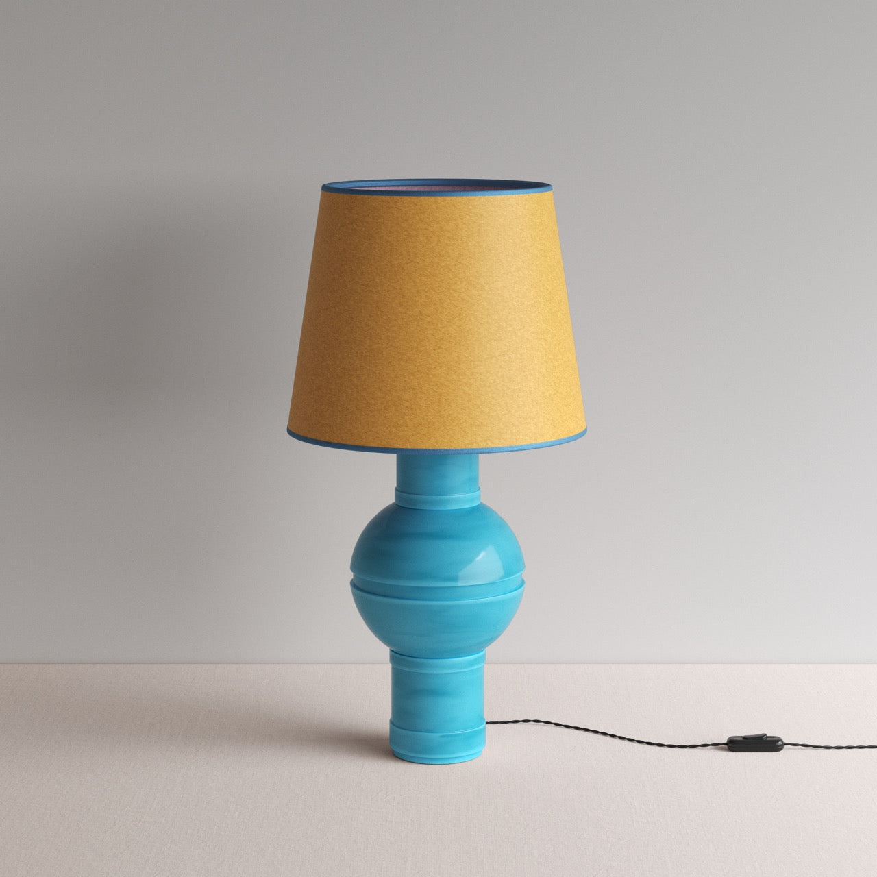 Orb Ceramic Table Lamp Base in Turquoise, With Humbug Straight Empire Paper Lamp Shade in Mustard with Blue Trim - Nicola Harding