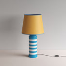  Humbug Striped Ceramic Table Lamp Base in Blue & Warm White, With Humbug Straight Empire Paper Lamp Shade in Mustard with Blue Trim - By NiX 