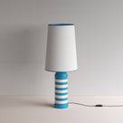  Humbug Striped Ceramic Table Lamp Base in Blue & Warm White, With Whimsical Tall Straight Empire Lamp Shade in Soft White with Peacock Blue Trim - By NiX 