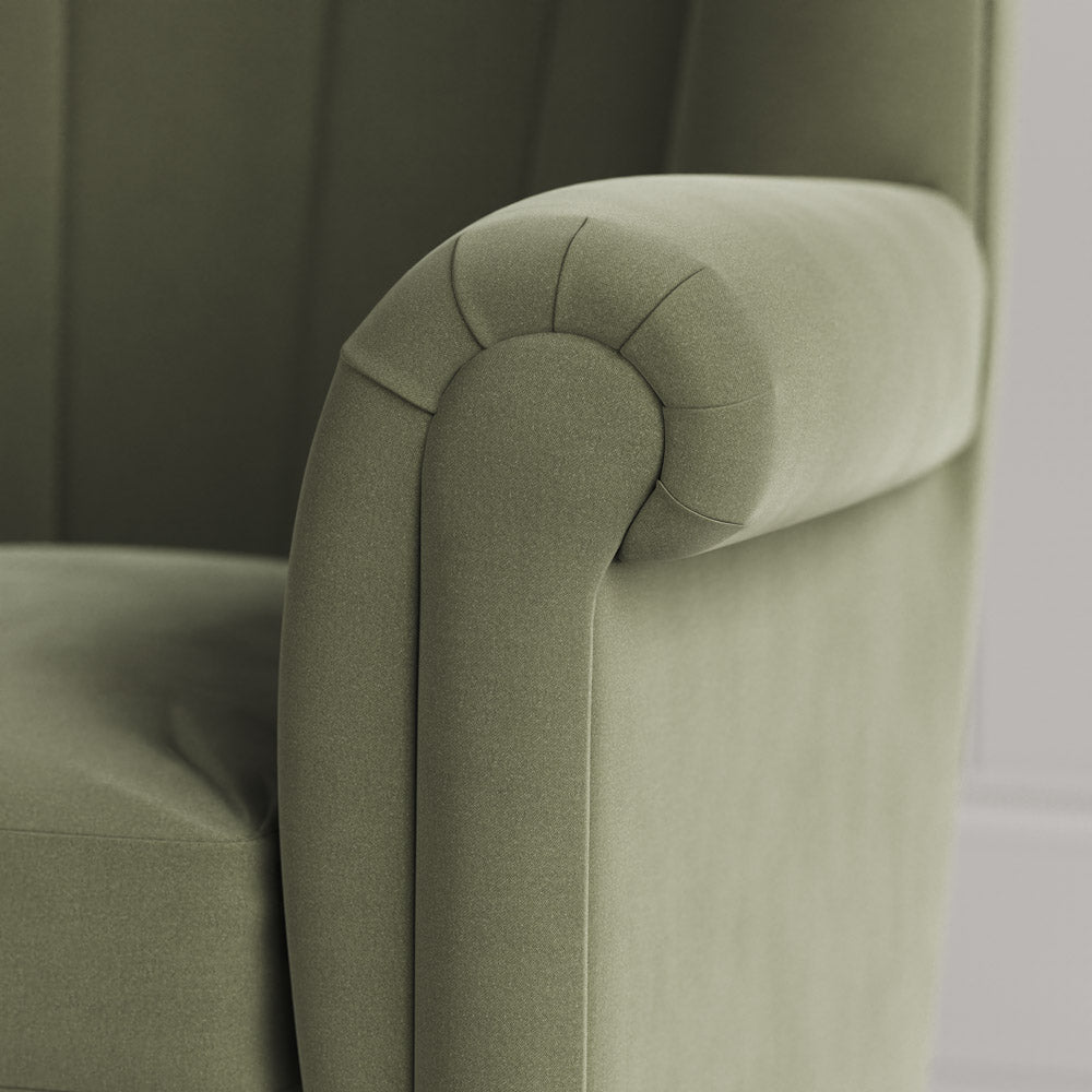  Time Out Armchair close-up detail of the rolled scroll arm and green tea velvet upholstery by NiX. 
