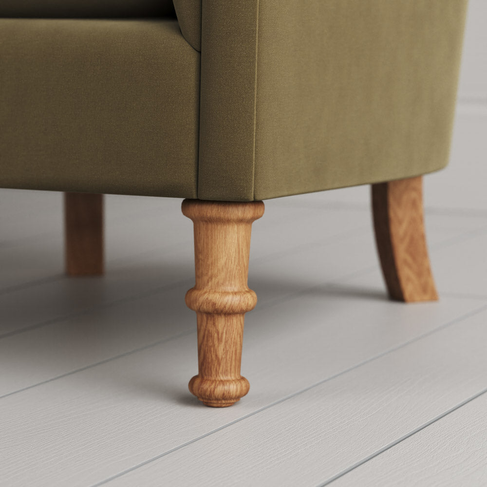  Nicola Harding design sustainable solid wood armchair foot close-up. 